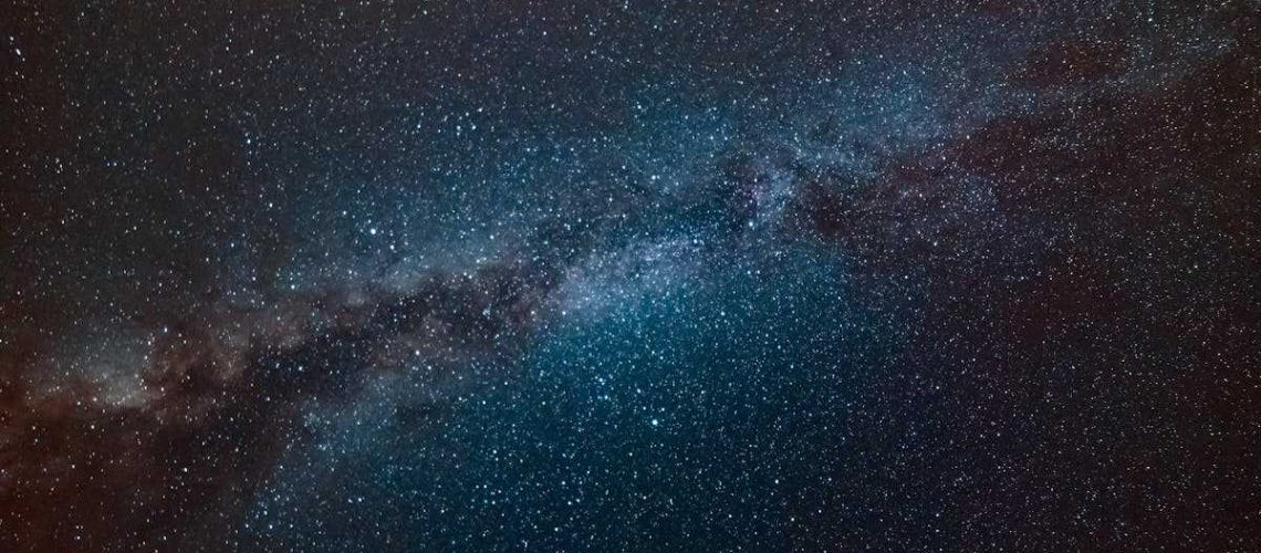 A stunning view of the Milky Way galaxy filling the night sky, showcasing countless stars.