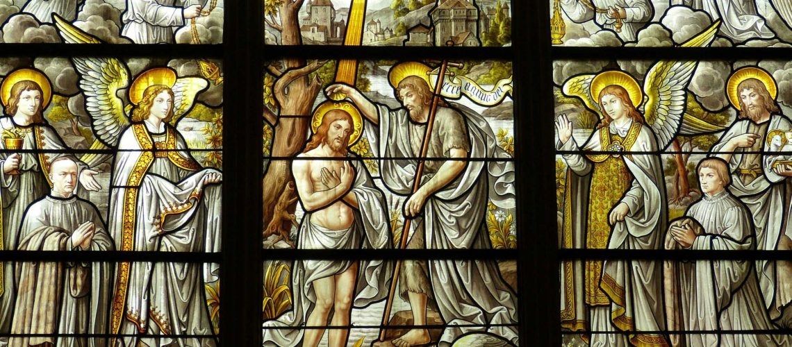 Detailed stained glass artwork illustrates biblical scenes in a church setting.